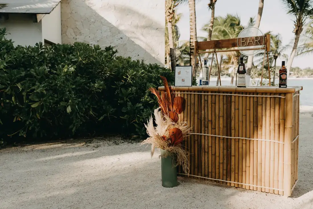 Bamboo back bar dressed with pampas and dried florals