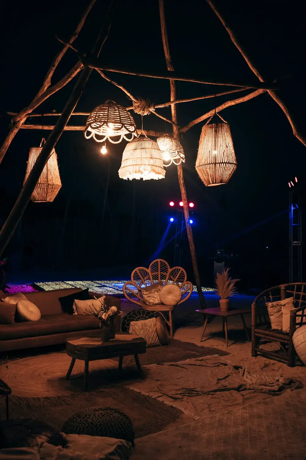 Night lounge with rattan lanterns and low timber furniture