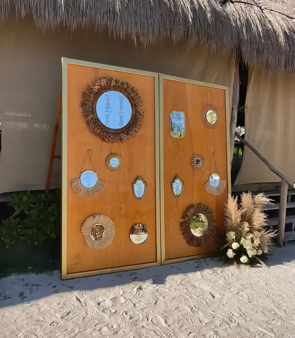 Seating chart of round mirrors mounted on a timber board