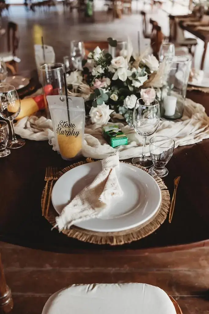 Tablescape with soft white and blush florals and clear glassware